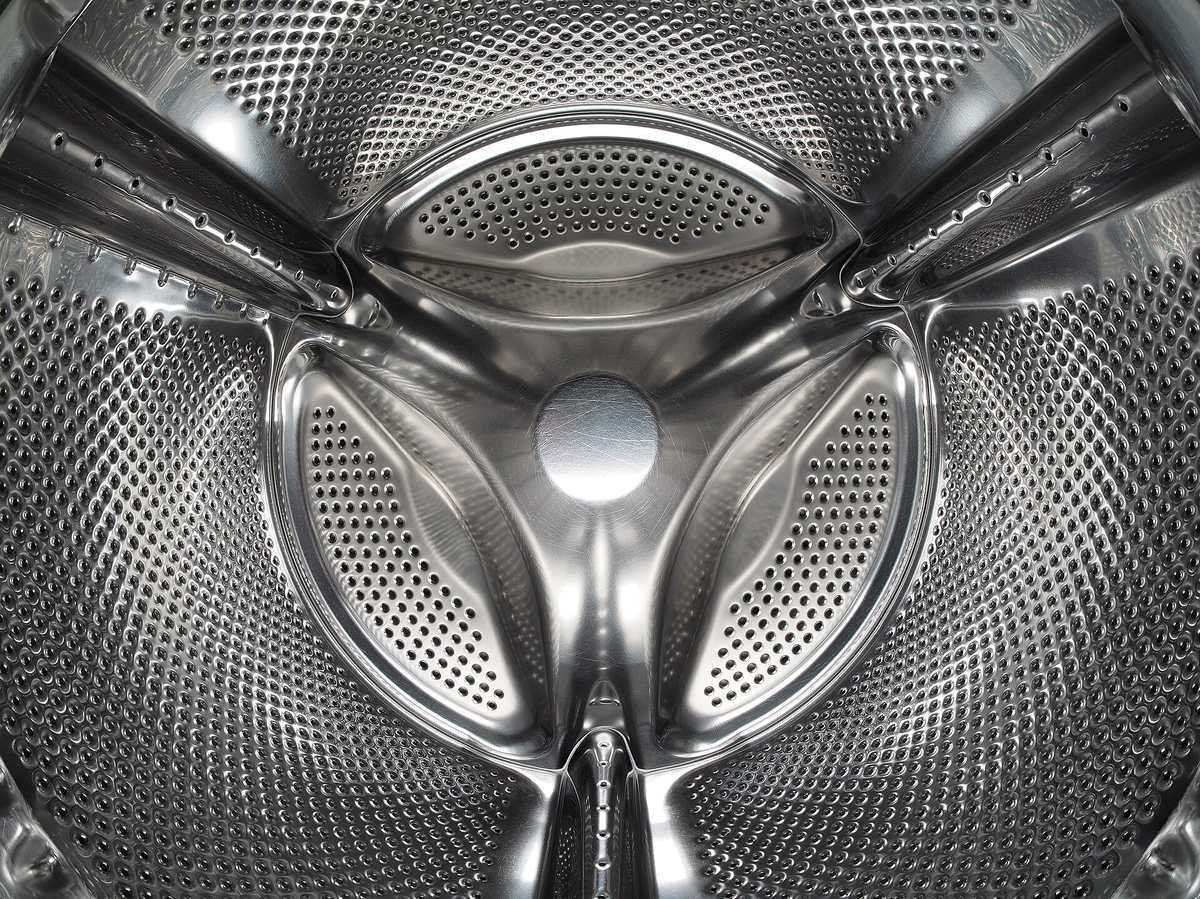 The stainless steel drum inside a front-loading washing machine.
